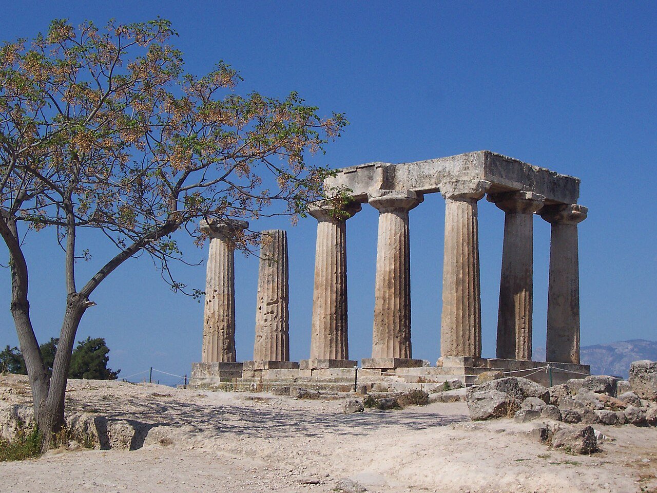 Seven Doric columns of the Temple of Apollo standing at Ancient Corinth archaeological site