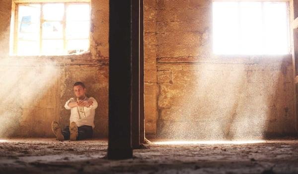 Athens airport taxi rank at night with yellow taxis queued under floodlights