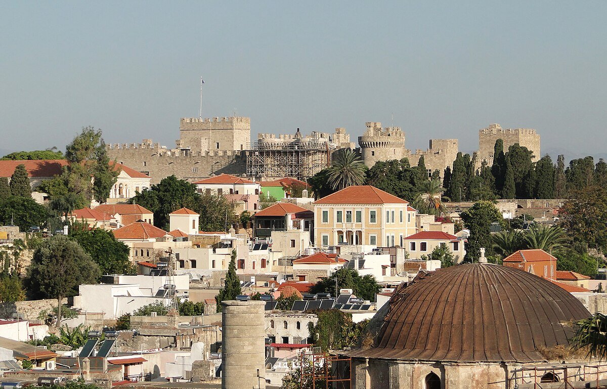 Medieval City of Rhodes old town cobblestone street and ancient walls