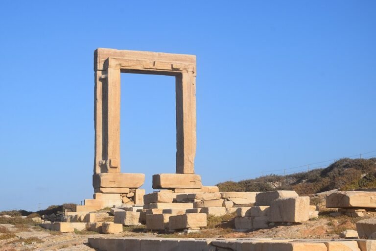 Temple of Apollo Portara marble arch at sunset in Naxos Greece