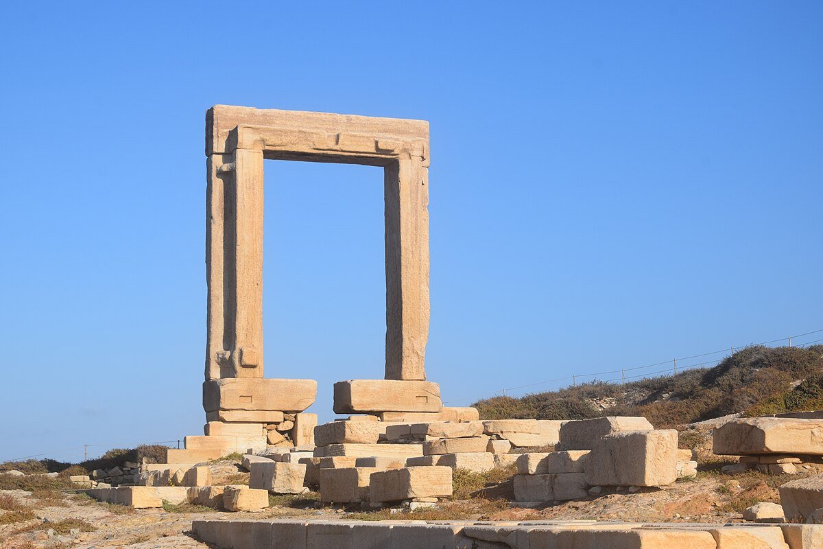 Temple of Apollo Portara marble arch at sunset in Naxos Greece