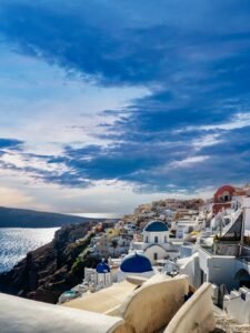 Iconic blue-domed churches overlooking the Santorini caldera, Greece