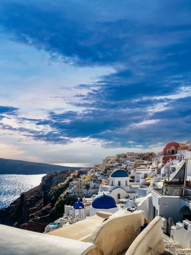 Iconic blue-domed churches overlooking the Santorini caldera, Greece