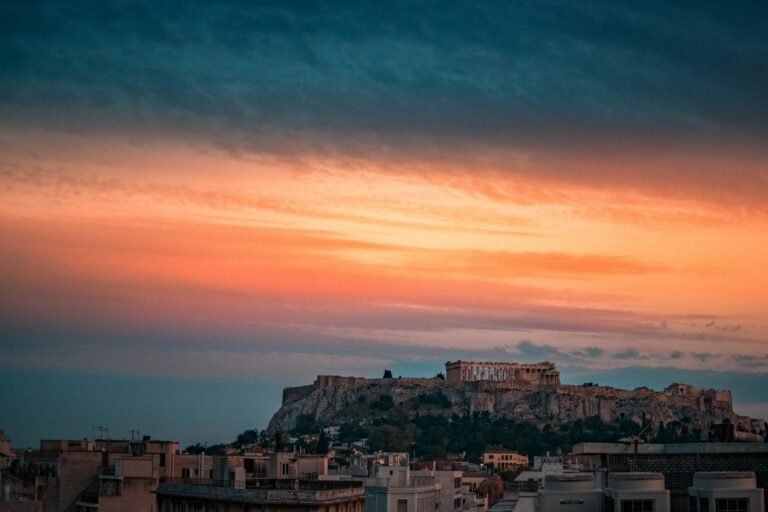 Greece travel statistics 2026 — aerial view of Athens with Acropolis and Lycabettus showcasing Greek tourism trends