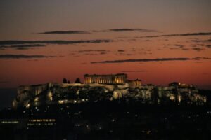 Athens airport transfer to Canopy by Hilton Athens — Acropolis glowing at sunset