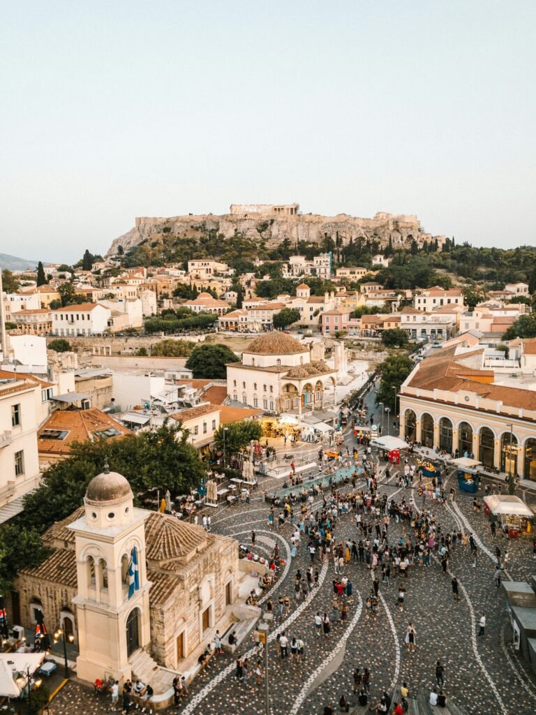 Athens airport transfer to Wyndham Grand Athens — Monastiraki square with Acropolis view